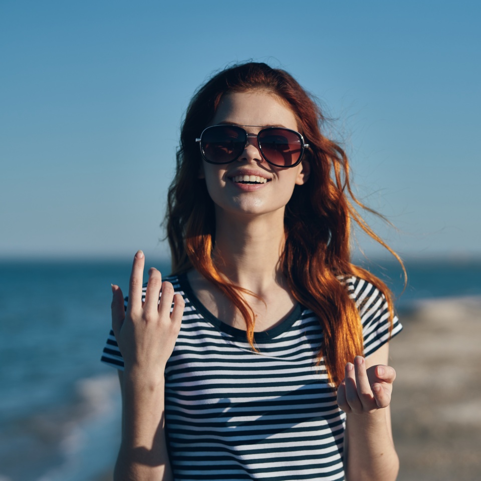 Woman in glasses and striped t-shirt in nature