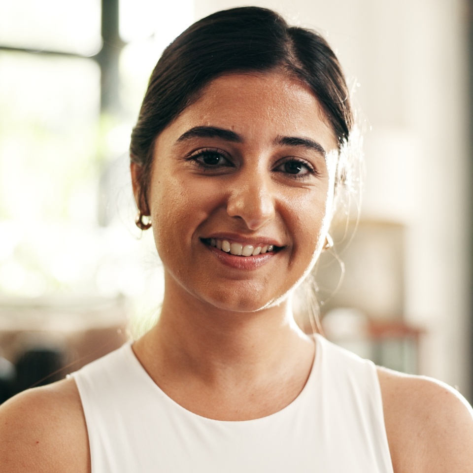 Portrait, exercise and yoga with woman in living room of home for health, pilates or wellness routine. Fitness, holistic and smile with Indian person on floor of apartment for mindful balance
