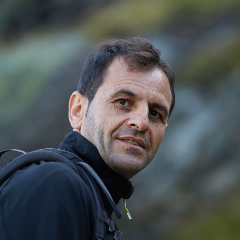 Closeup of a caucasian hiker man with backpack, selective focus