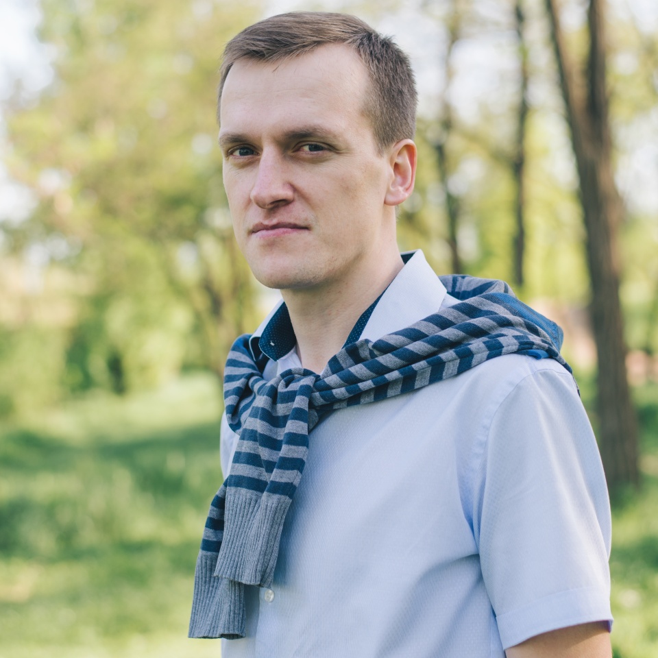 portrait of young stylish man in spring park